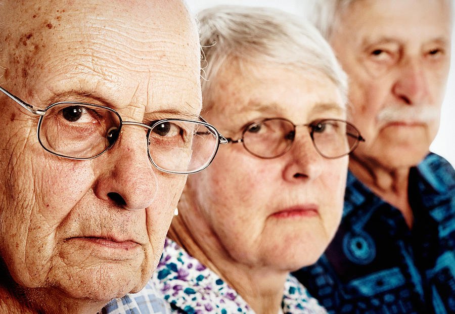 three grumpy seniors two men one woman frowning disappointed rapideye